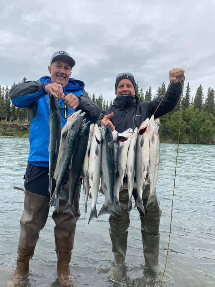 2 men showing their fishing catch