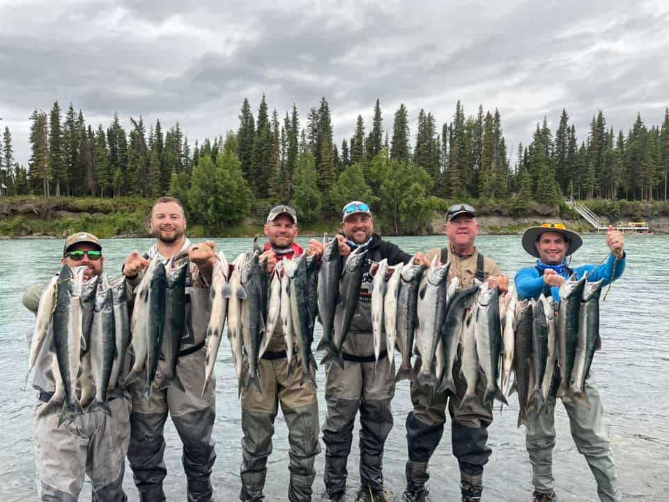 6 men showing their fishing catch